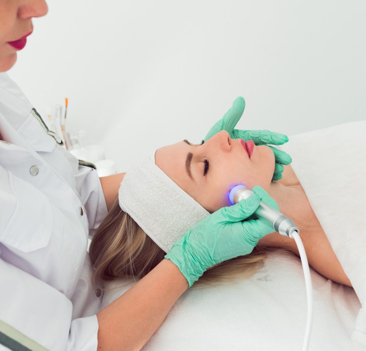 Radio frequency skin tightening, young woman in cosmetology clinic